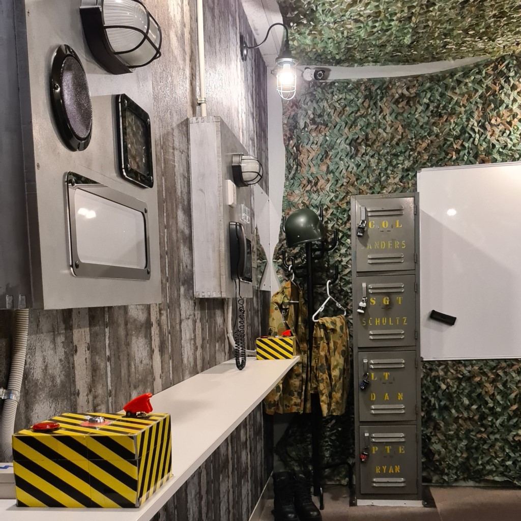 Image of the Launch Escape Room showing launch boxes and wall panels
