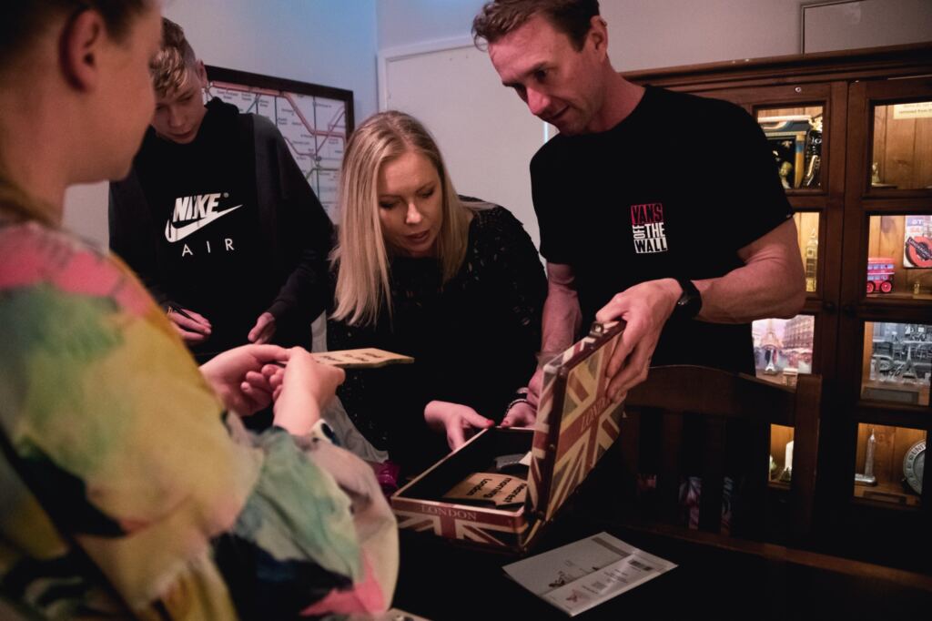 A team working together to solve our escape room near windsor