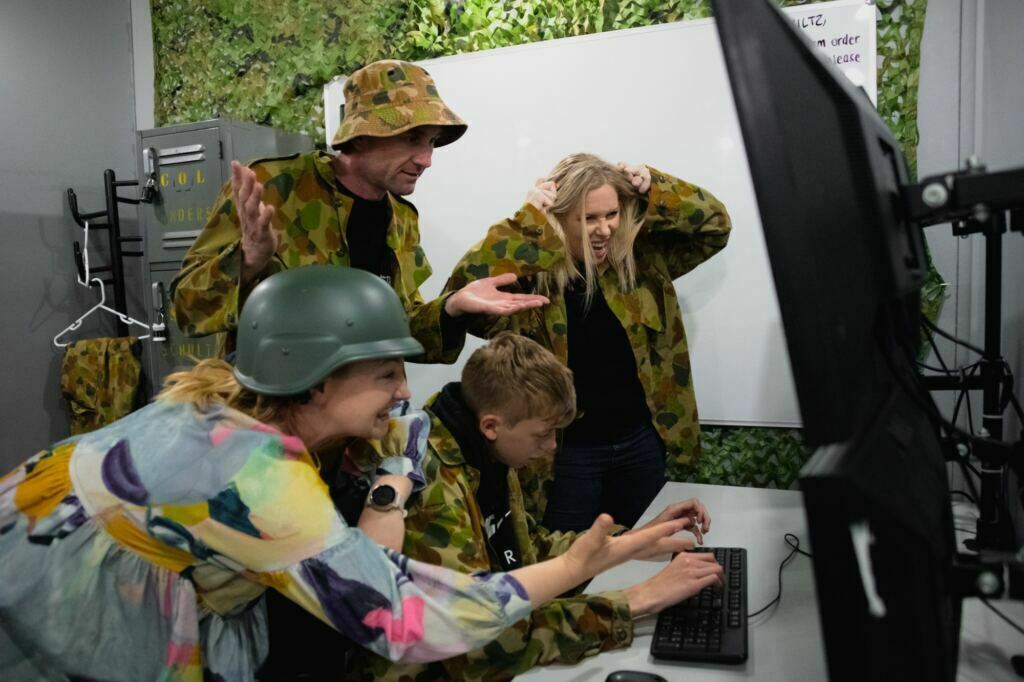 Players in Launch experiencing the time pressure of one of the best escape rooms in Sydney.