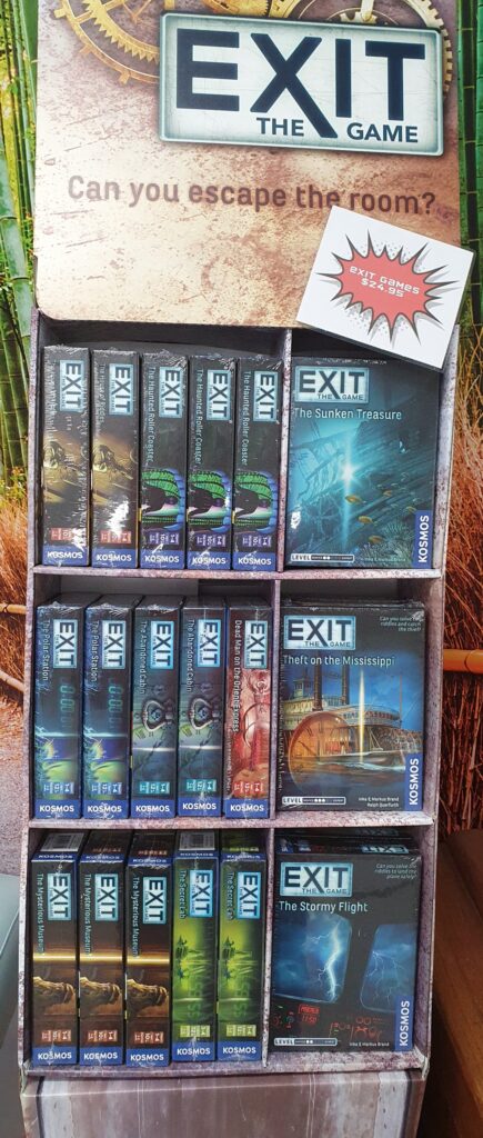 The large selection of "Exit The Game" escape room board games available for purchase onsite at Narrow Escape Rooms Sydney.